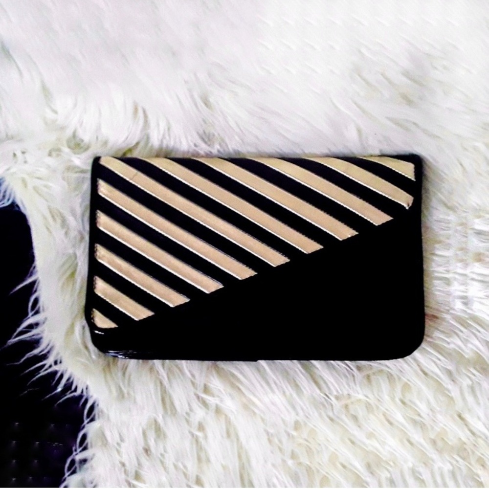 black and gold striped diagonal flap clutch